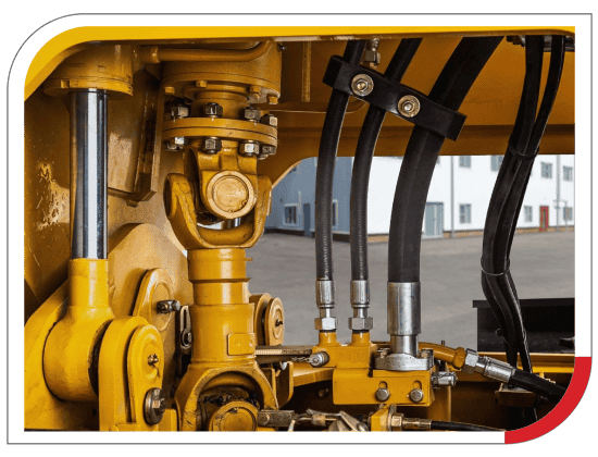 Hydraulic engine component close-up showing hoses, valves, and pistons.